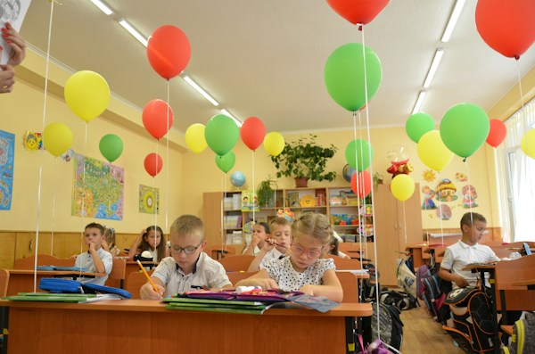 Students reading and writing in class